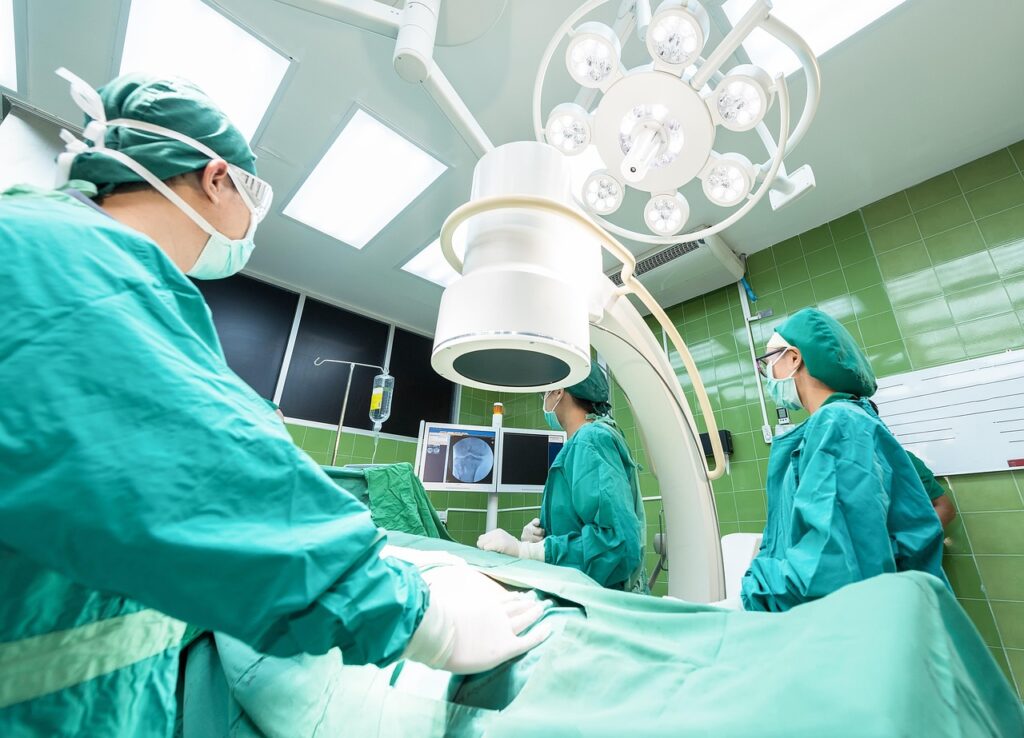 A team of diverse and happy NHS healthcare workers in a UK hospital.